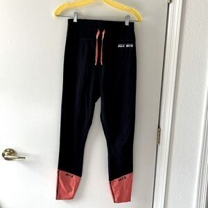 SDX WFA White Fox X Sarah’s Day Leggings Size M Gently used Black/orange